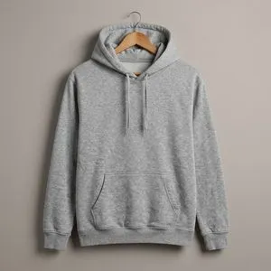 A grey hoodie on a wooden hanger against a warm neutral wall.